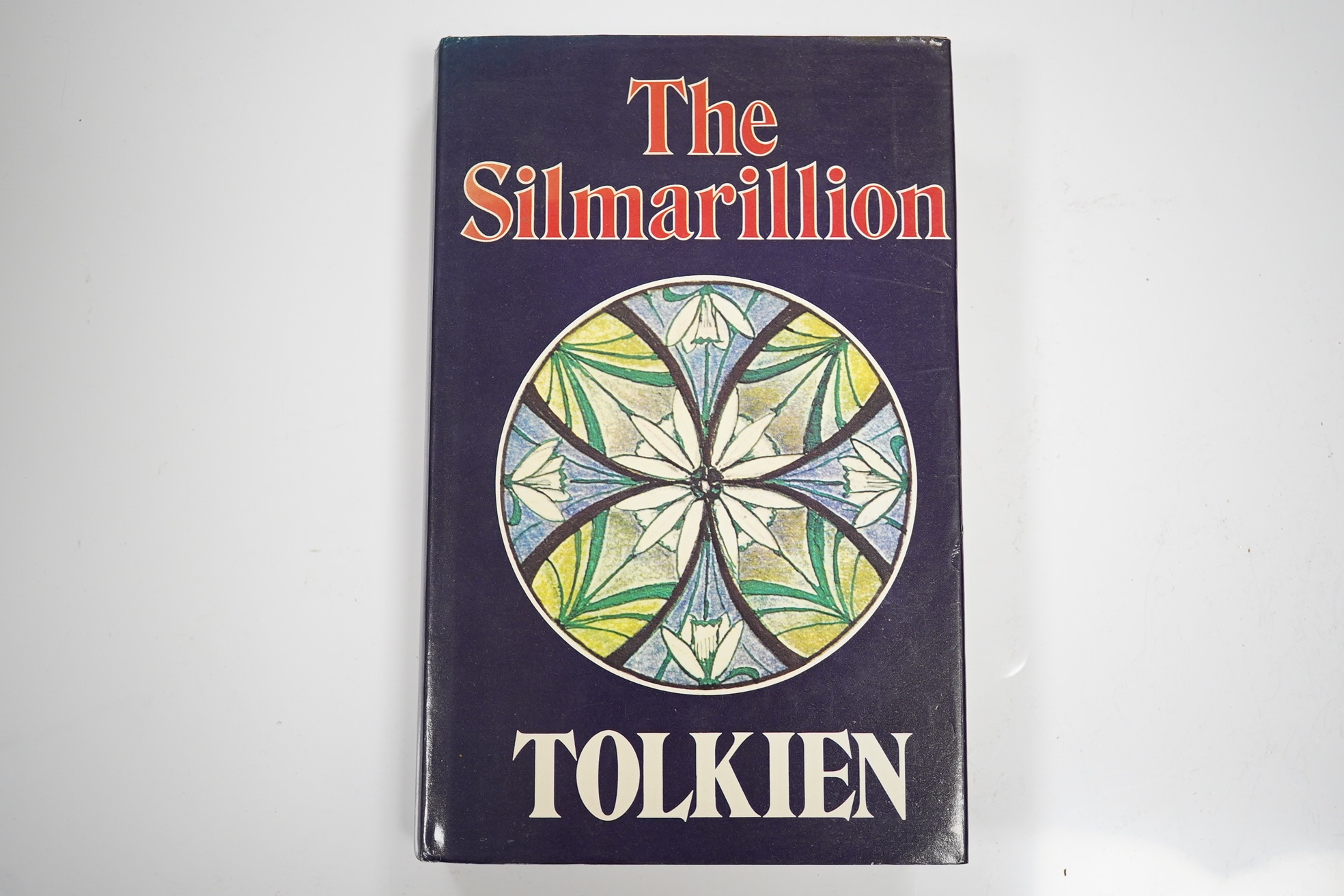 Tolkien, J.R.R. The Silmarillion. Edited by Christopher Tolkien. First Edition. large folded and coloured pictorial map, title within decorated borders; publisher's gilt cloth and d/wrapper. George Allen & Unwin, 1977